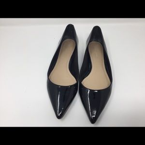 Black patent leather flats.